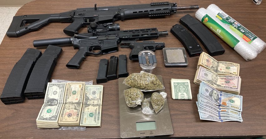 A felony amount of marijuana and more than $3,000 dollars in cash was seized in a drug raid that netted two arrests, Tuesday by city and county law enforcement.